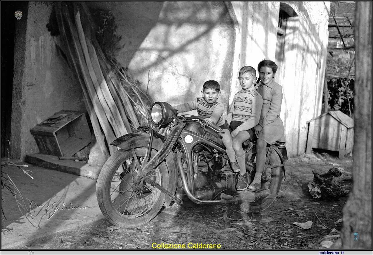 Ettore, Enrico e Liliana Maestri sulla BMW.jpg